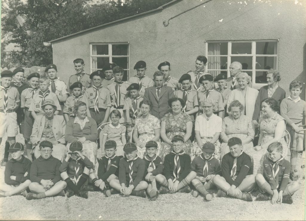 Cubs, Scouts and supporters in the 1950s. Sir Richard Bevan is on the right of the back row.