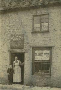 Mrs. Cooper outside shop in West End